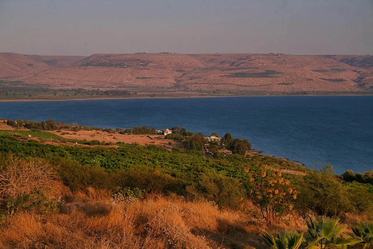 Pilgrims gathered on the lawn beside the octagonal church of the Beatitudes overlooking the Sea of Galilee