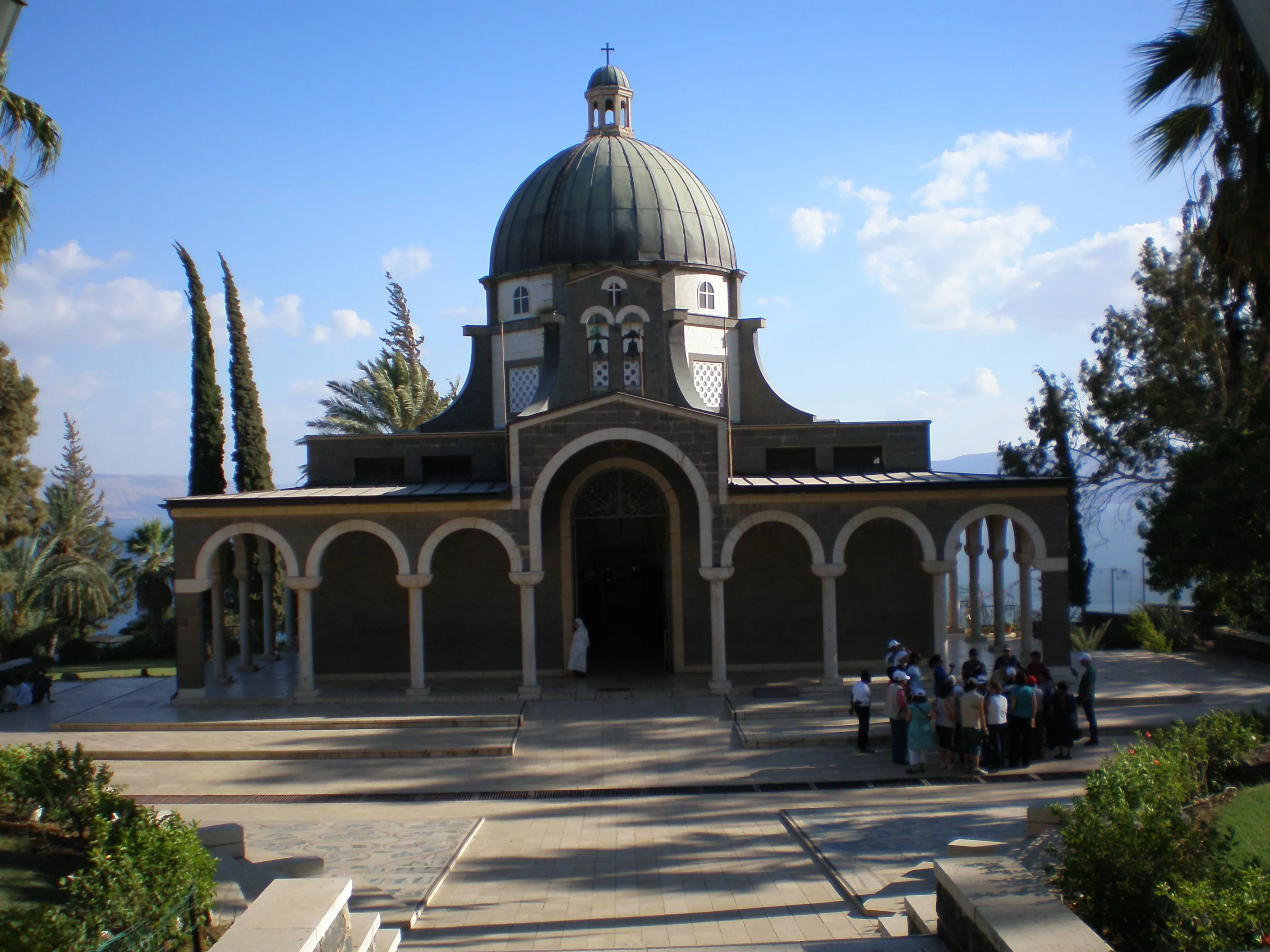 The octagonal Catholic church of the Beatitudes on a green hillside above the Sea of Galilee